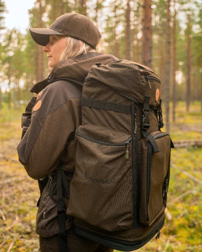 Dark Brown Coloured Pinewood Finnveden Hybrid Cap on outdoor background 