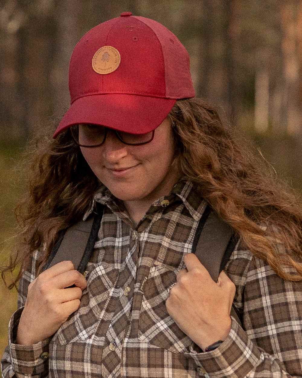 Dark Tomato Dark Red Coloured Pinewood Finnveden Hybrid Cap on outdoor background 