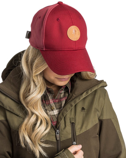 Dark Tomato Dark Red Coloured Pinewood Finnveden Hybrid Cap on white background 