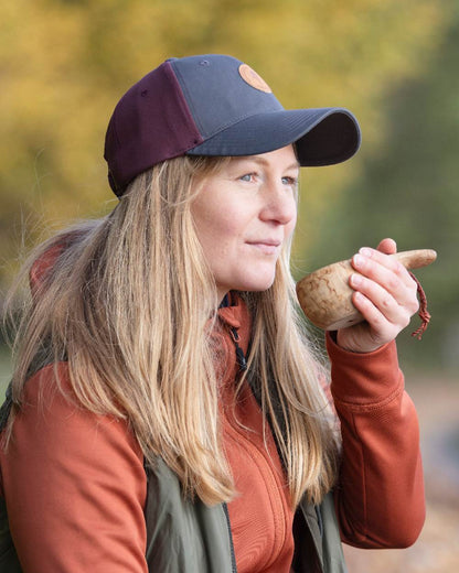 Earth Plum Dark Anthracite Coloured Pinewood Finnveden Hybrid Cap on outdoor background 