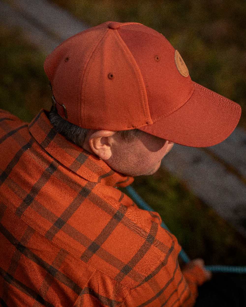 Terracotta Coloured Pinewood Finnveden Hybrid Cap on outdoor background 