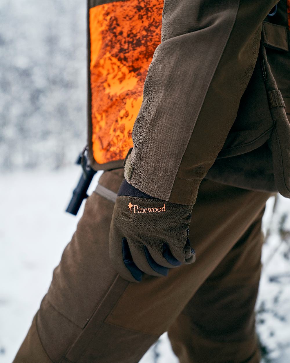 Moss Green Black Coloured Pinewood Hunters Neoprene Gloves on snow background 