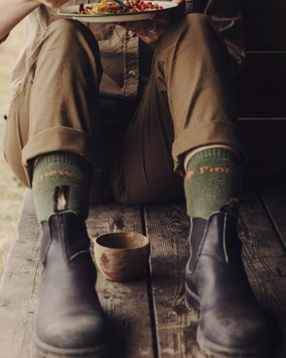 Olive coloured Pinewood Insectsafe Long Socks on outdoor background 