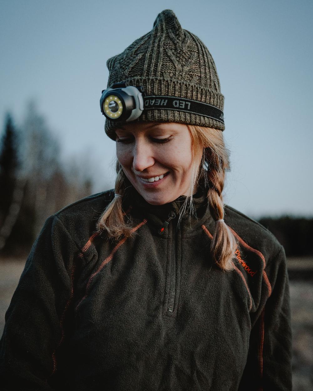 Green Mel Coloured Pinewood Knitted Melange Hat on outdoor background 