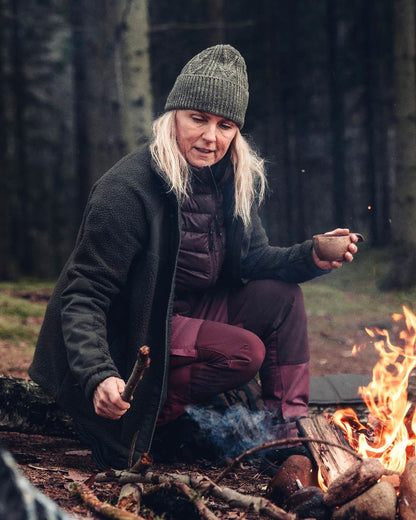 Green Mel Coloured Pinewood Knitted Melange Hat on outdoor background 