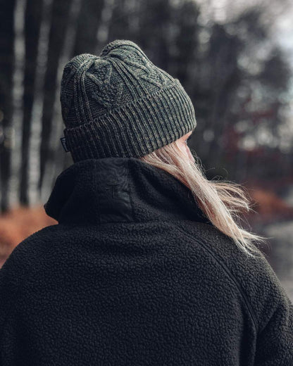 Green Mel Coloured Pinewood Knitted Melange Hat on outdoor background 