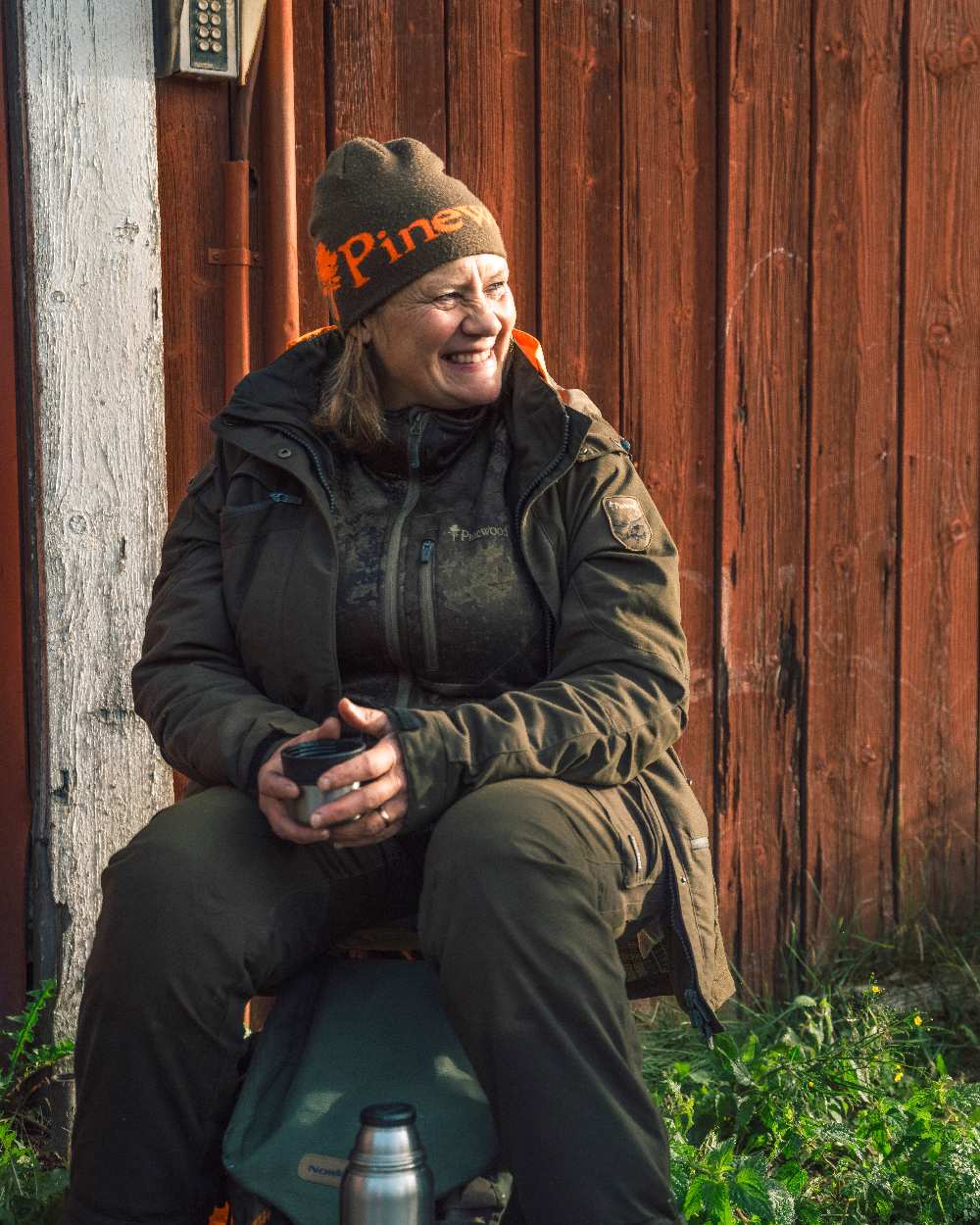 Green Orange Coloured Pinewood Melange Hat on outdoor background 