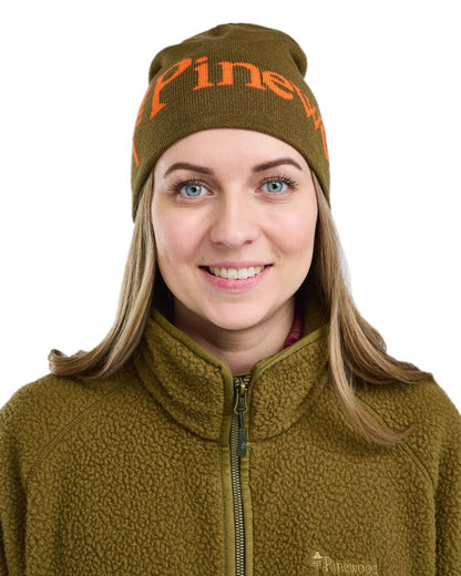 Green Orange Coloured Pinewood Melange Hat on white background 