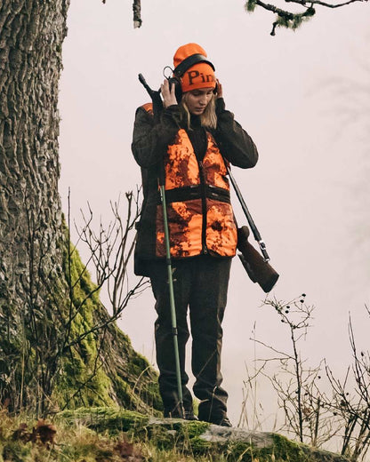 Orange Green Coloured Pinewood Melange Hat on outdoor background 