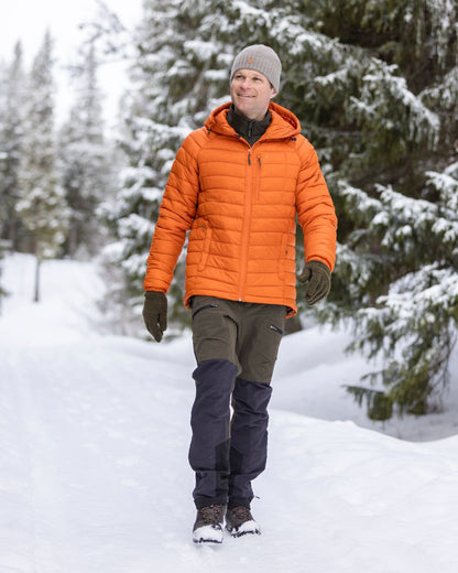 Moss Green Coloured Pinewood Mens Abisko Adventure Trousers on snow background 