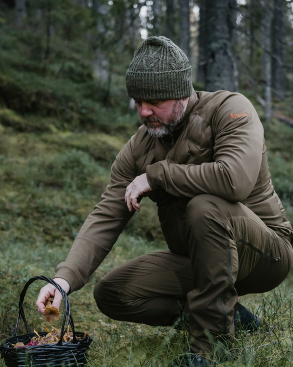 Olive Green Hunting Olive Coloured Pinewood Mens Abisko Brenton Trousers on forest background 