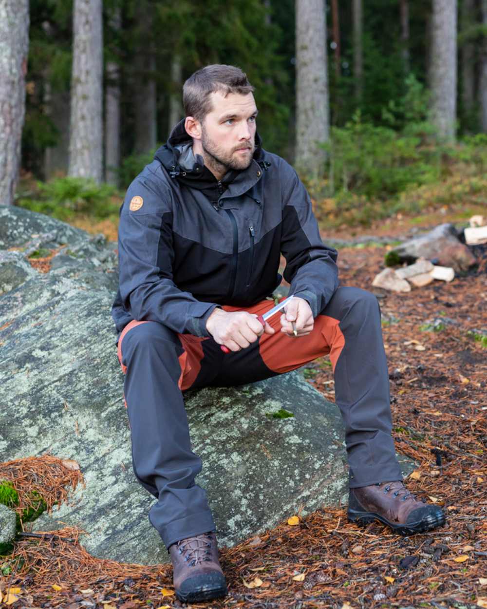 Terracotta Dark Anthracite Coloured Pinewood Mens Abisko Brenton Trousers on outdoor background 