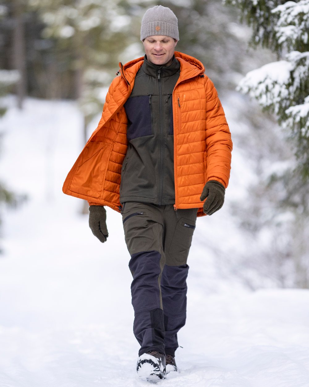 Burned Orange Coloured Pinewood Mens Abisko Insulation Jacket on snow background 