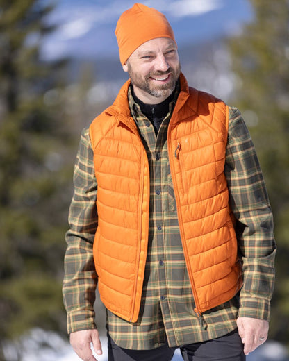 Burned Orange Coloured Pinewood Mens Abisko Insulation Vest on snow background 