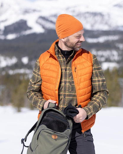 Burned Orange Coloured Pinewood Mens Abisko Insulation Vest on snow background 