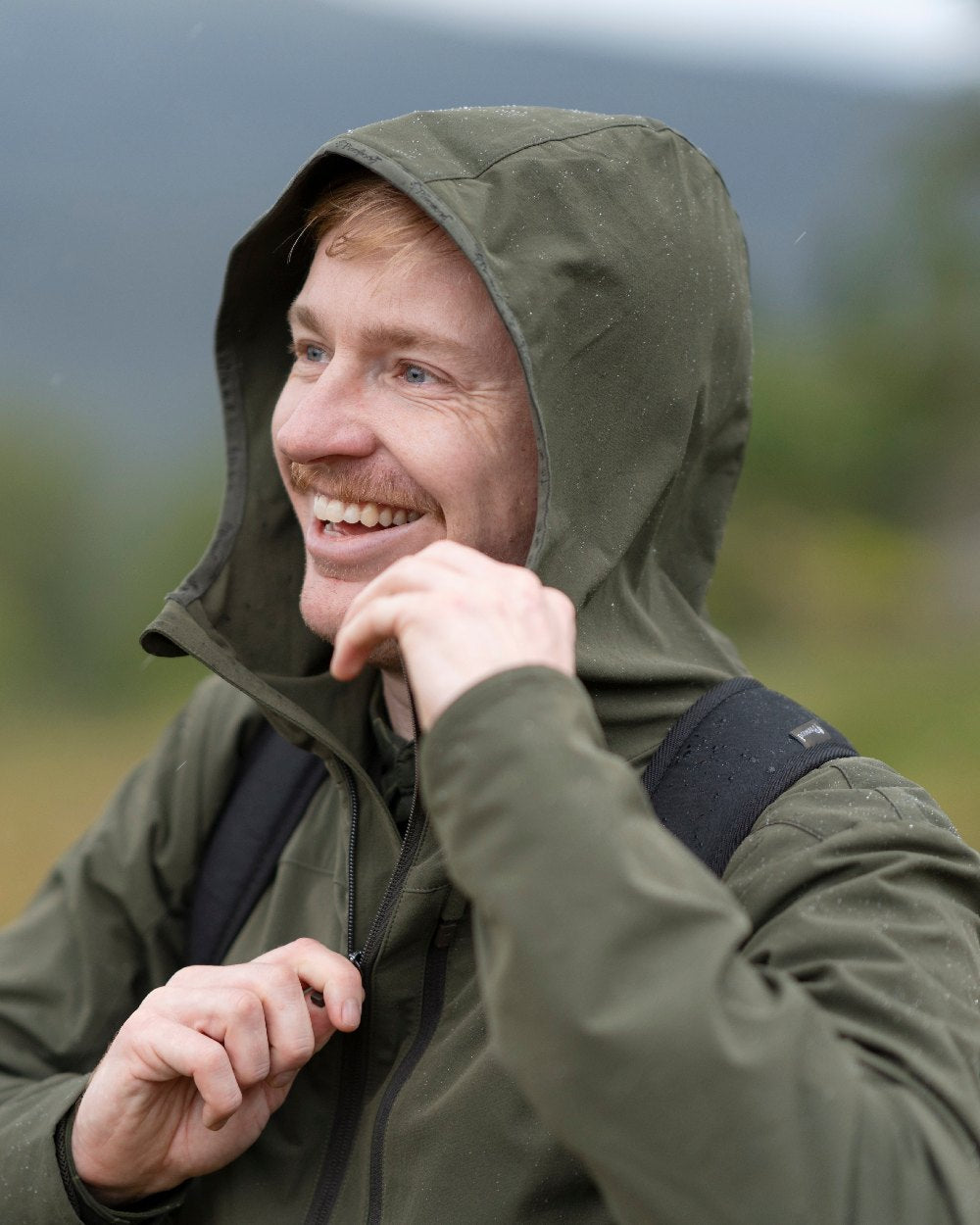 Mossgreen Coloured Pinewood Mens Abisko Light Stretch Jacket on outdoor background 