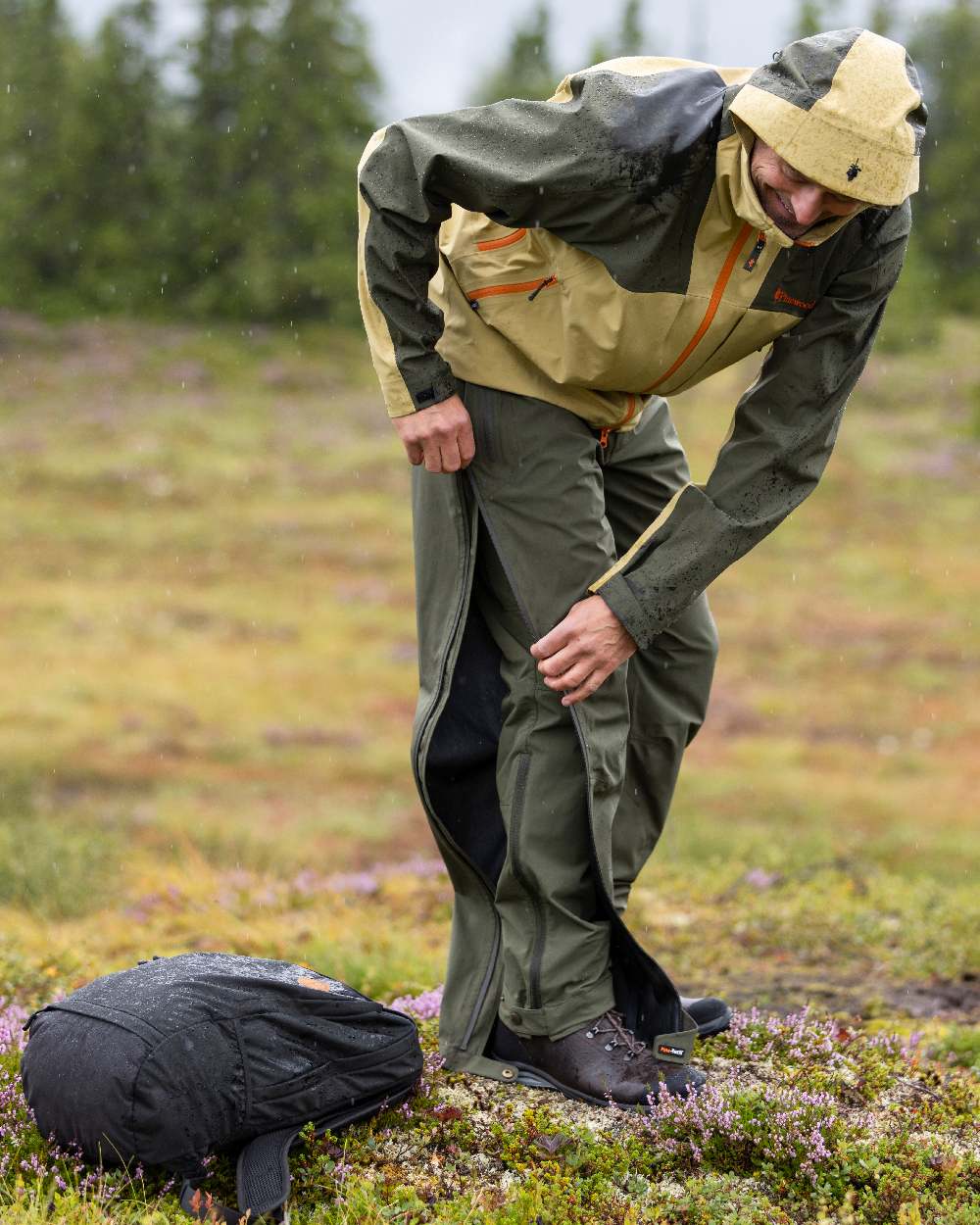 Mossgreen Coloured Pinewood Mens Abisko Light Stretch Trousers on outdoor background 