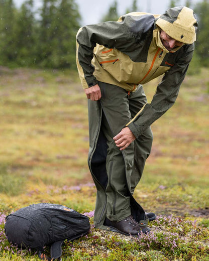 Mossgreen Coloured Pinewood Mens Abisko Light Stretch Trousers on outdoor background 