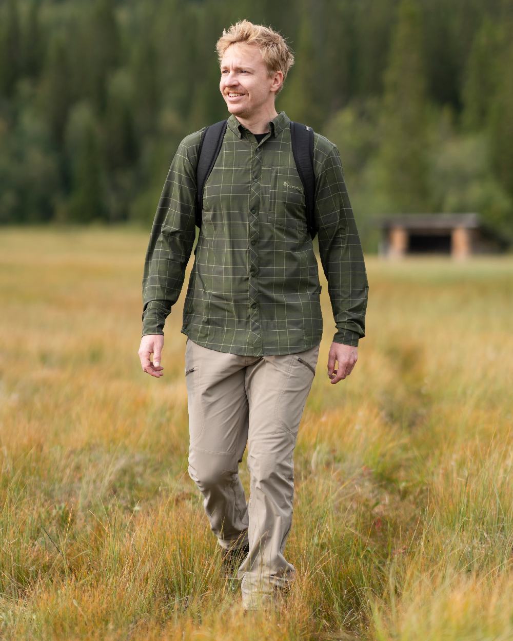 Moss Green Coloured Pinewood Mens Abisko Trekking Long Sleeve Shirt on outdoor background 