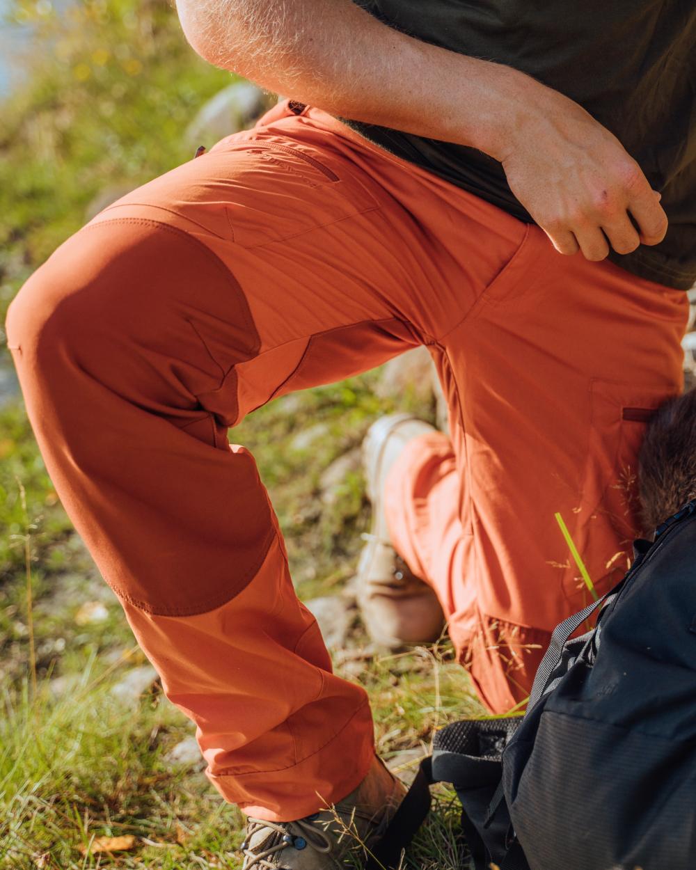 Burned Orange Terracotta Coloured Pinewood Mens Caribou TC Trousers on lake background 