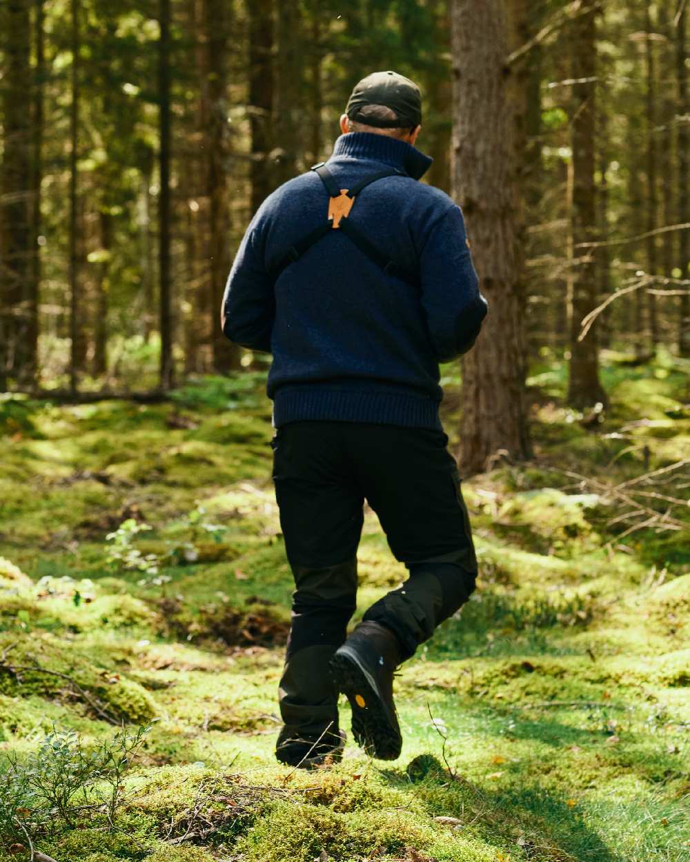 Moss Green Black Coloured Pinewood Mens Caribou Tc Extreme Trousers on forest background 