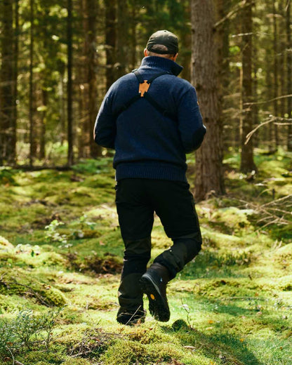 Moss Green Black Coloured Pinewood Mens Caribou Tc Extreme Trousers on forest background 