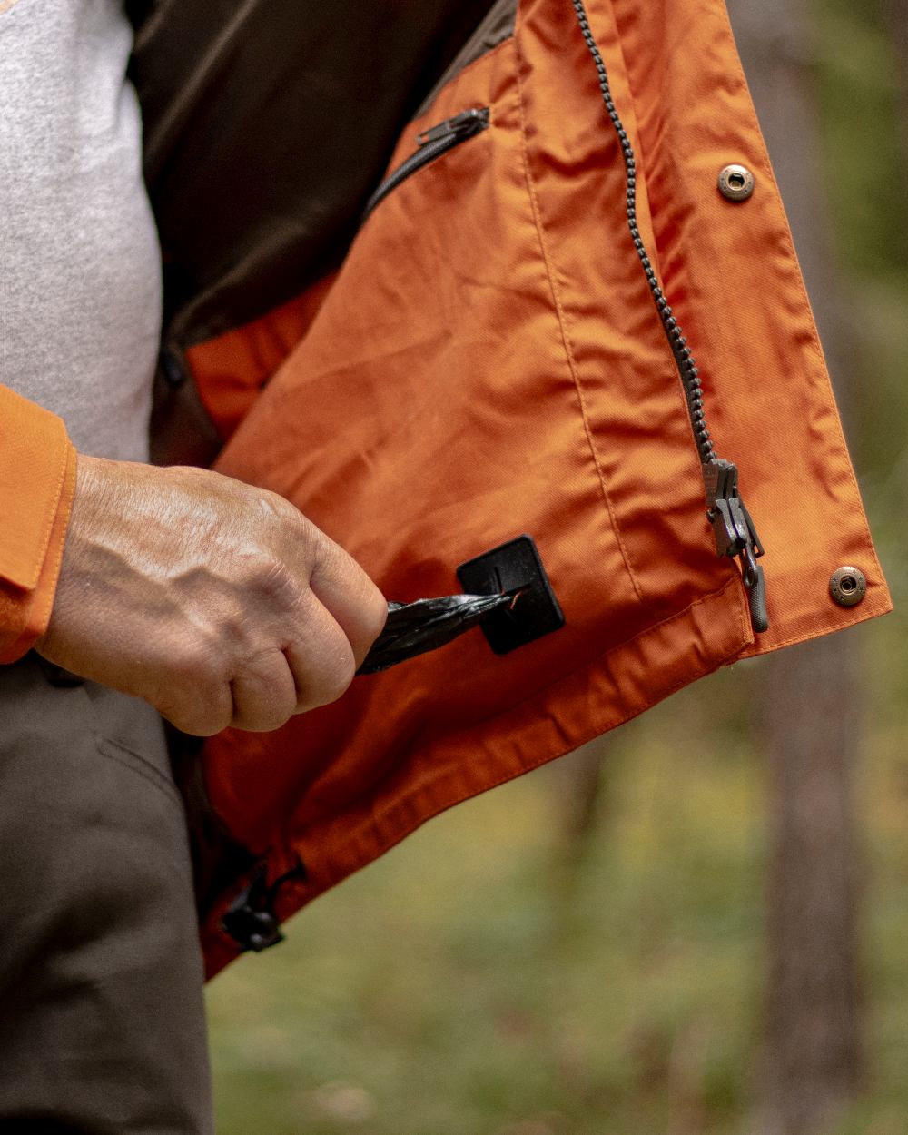 Burned Orange Coloured Pinewood Mens Dog Sports Trainer Jacket on outdoor background 