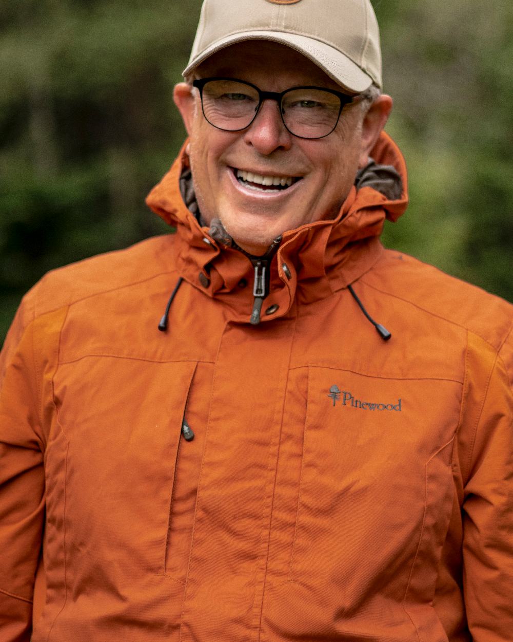 Burned Orange Coloured Pinewood Mens Dog Sports Trainer Jacket on outdoor background 