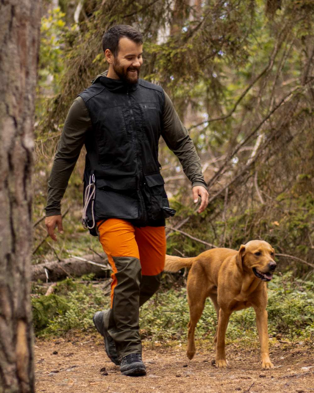 Black Coloured Pinewood Mens Dog Sports Trainer Vest on outdoor background 