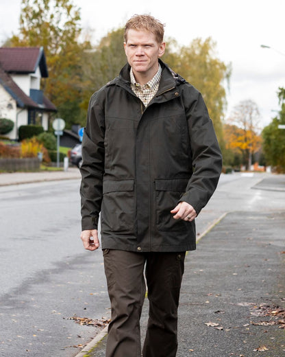 Dark Olive Coloured Pinewood Mens Finnveden Classic Trousers on outdoor background 