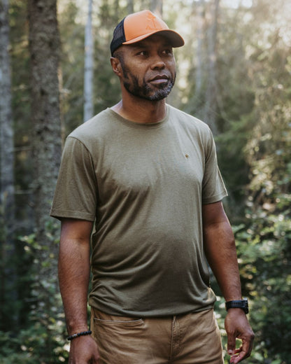 Olive Green coloured Pinewood Mens Finnveden Forest T-Shirt on forest background 