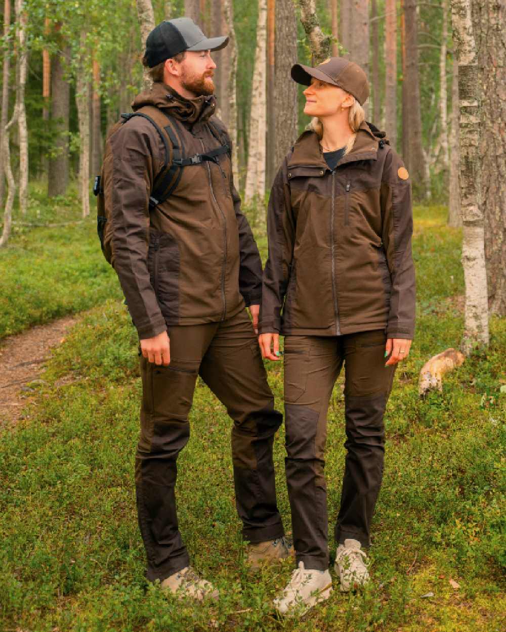 Dark Brown Coloured Pinewood Mens Finnveden Hybrid Jacket on outdoor background 
