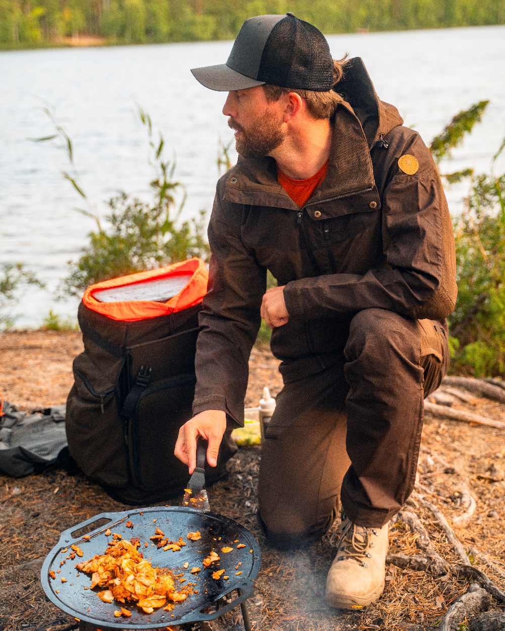 Dark Brown Coloured Pinewood Mens Finnveden Hybrid Jacket on outdoor background 