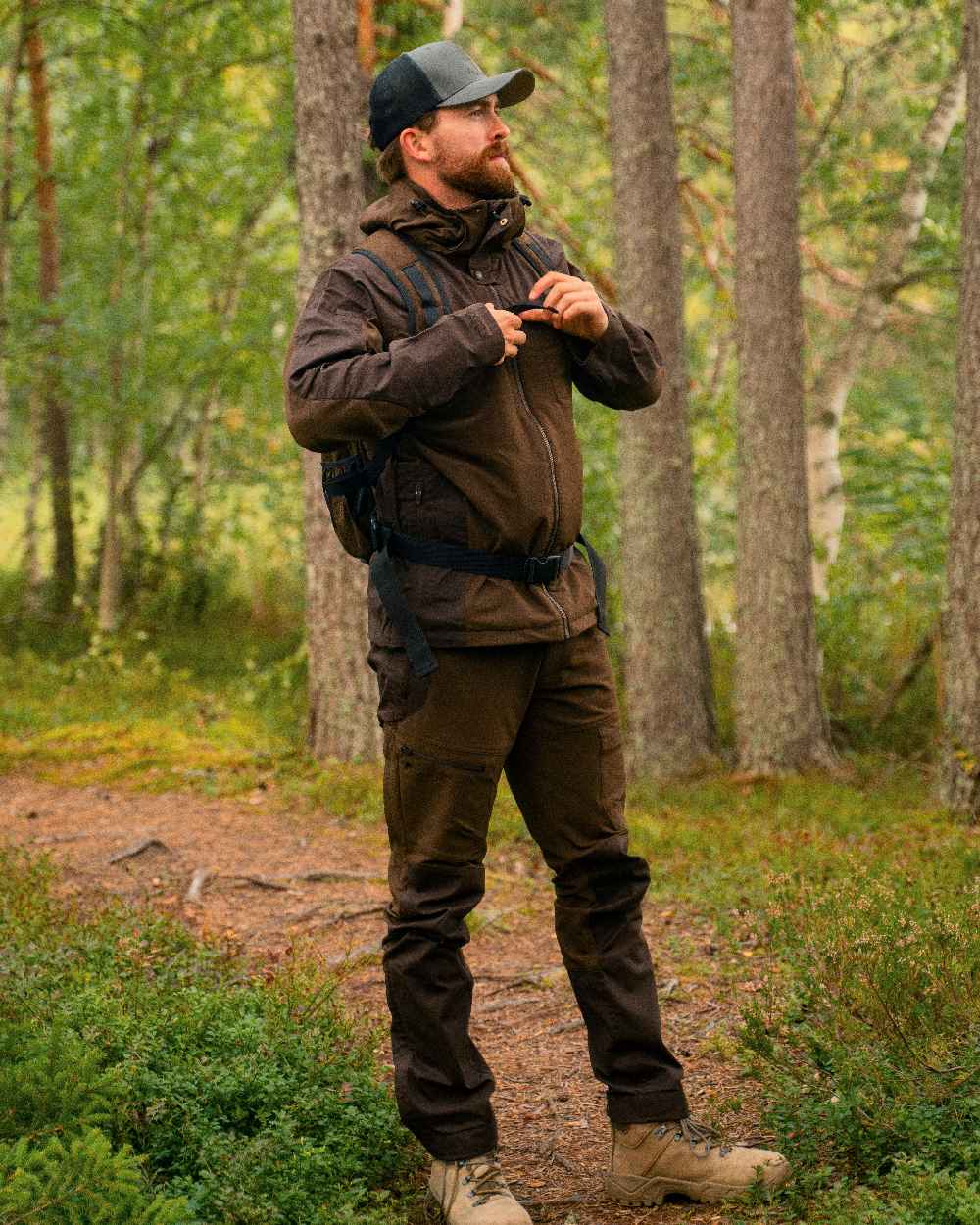 Dark Brown Coloured Pinewood Mens Finnveden Hybrid Jacket on outdoor background 