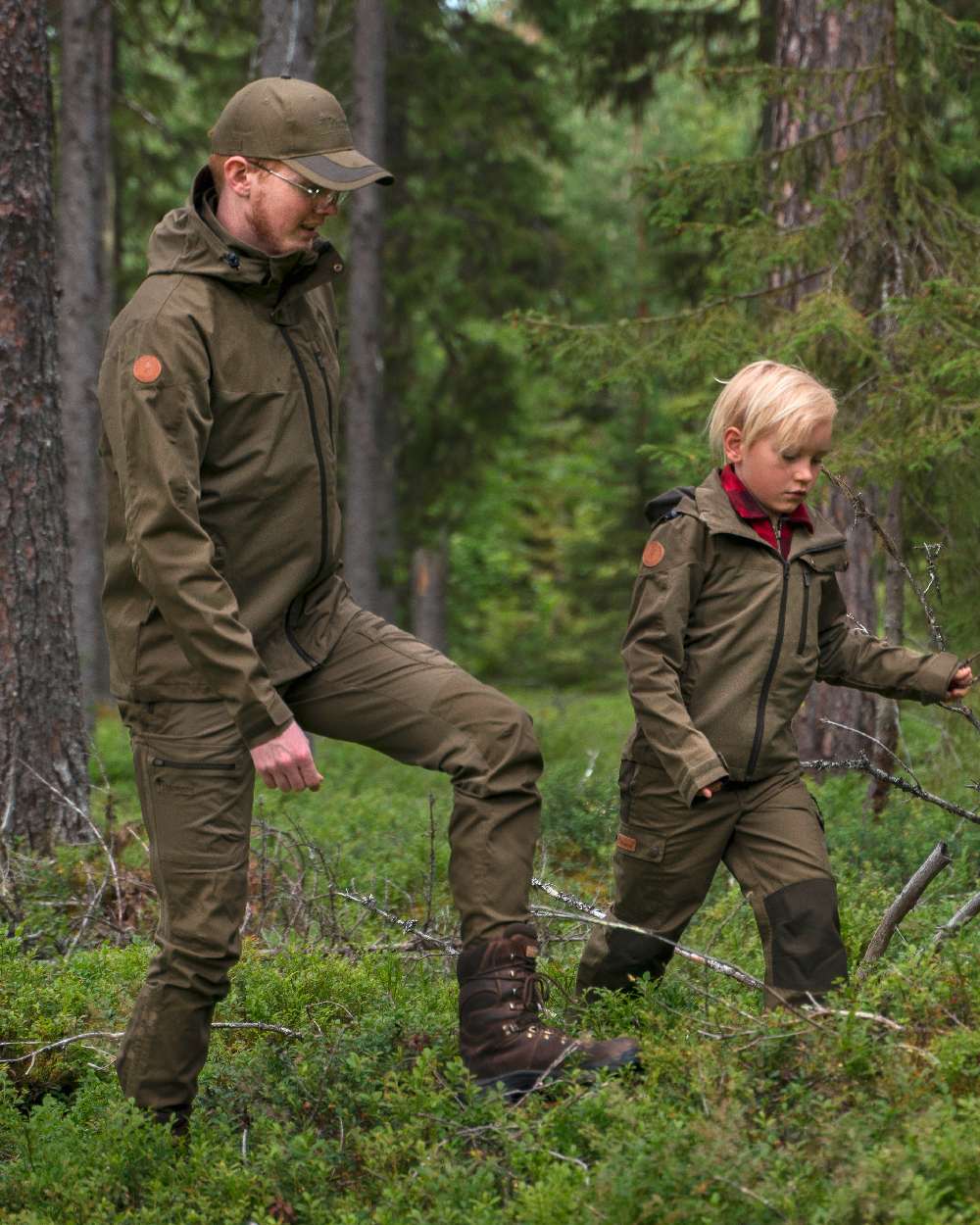 Hunting Olive Coloured Pinewood Mens Finnveden Hybrid Trousers on outdoor background 