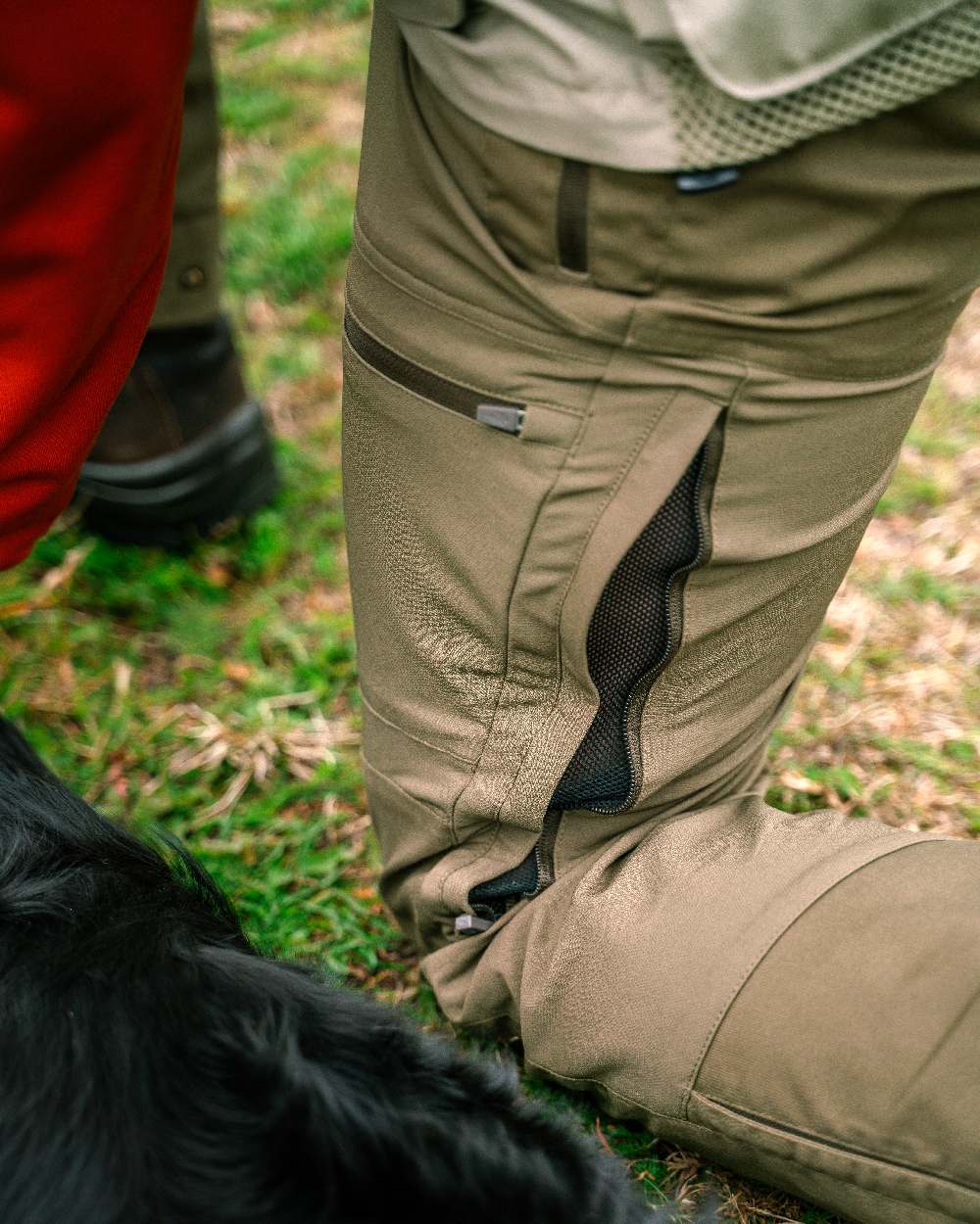Hunting Olive Coloured Pinewood Mens Finnveden Hybrid Trousers on outdoor background 