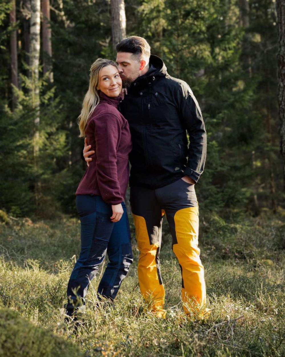 Black coloured Pinewood Mens Finnveden Hybrid Jacket on forest background 