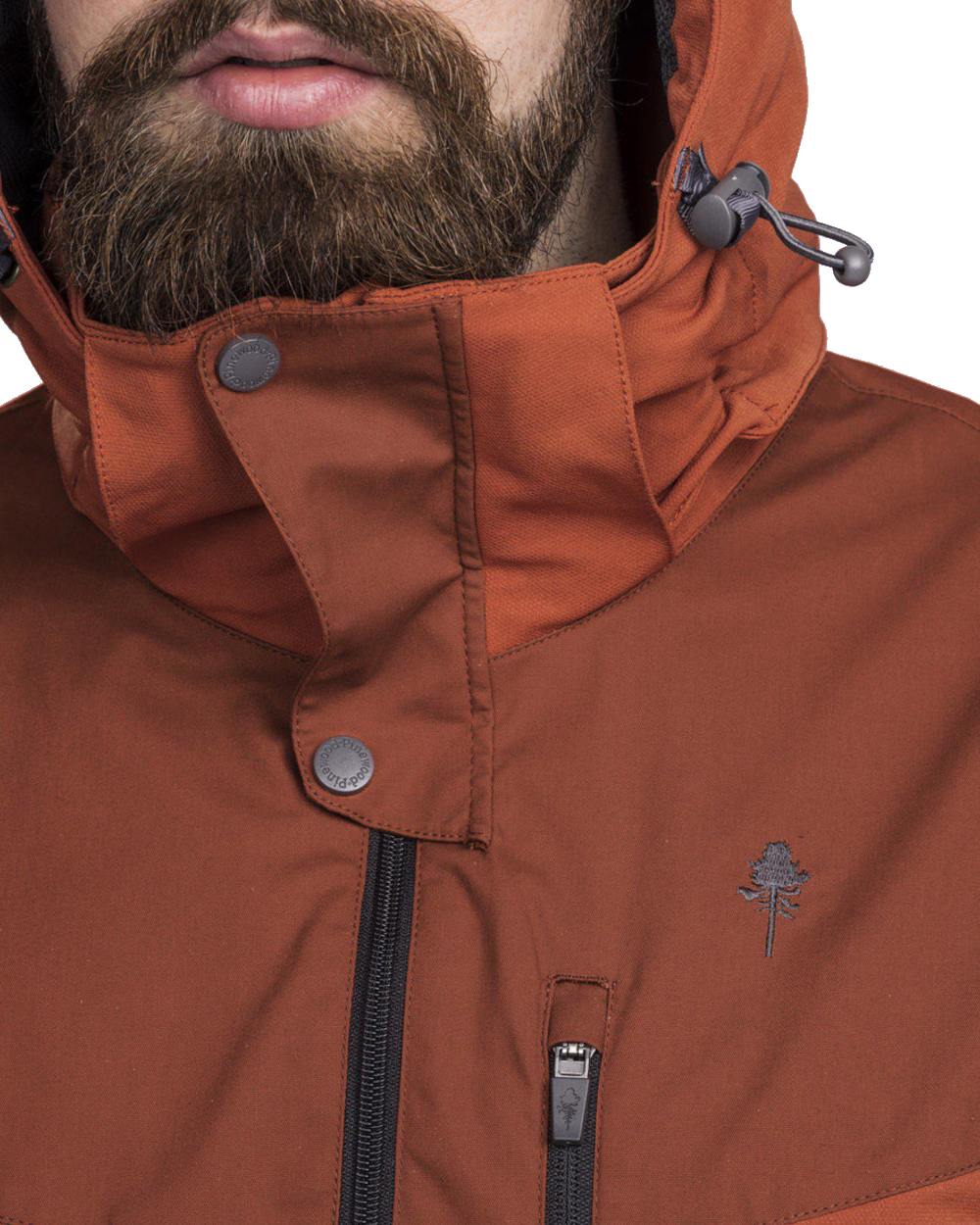 Terracotta coloured Pinewood Mens Finnveden Hybrid Jacket on white background 