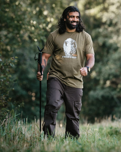 Dark Brown Coloured Pinewood Mens Finnveden Outdoor Trousers on forest background 