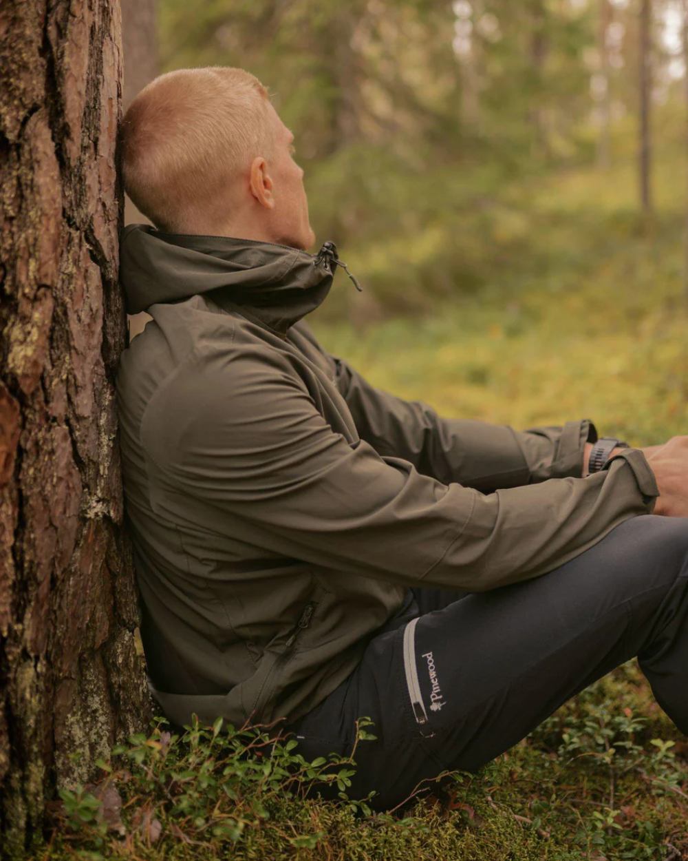 Black coloured Pinewood Mens Finnveden Trail Stretch Trousers on forest background 