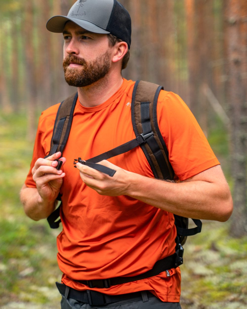 Burned Orange coloured Pinewood Mens Function T-Shirt on forest background 