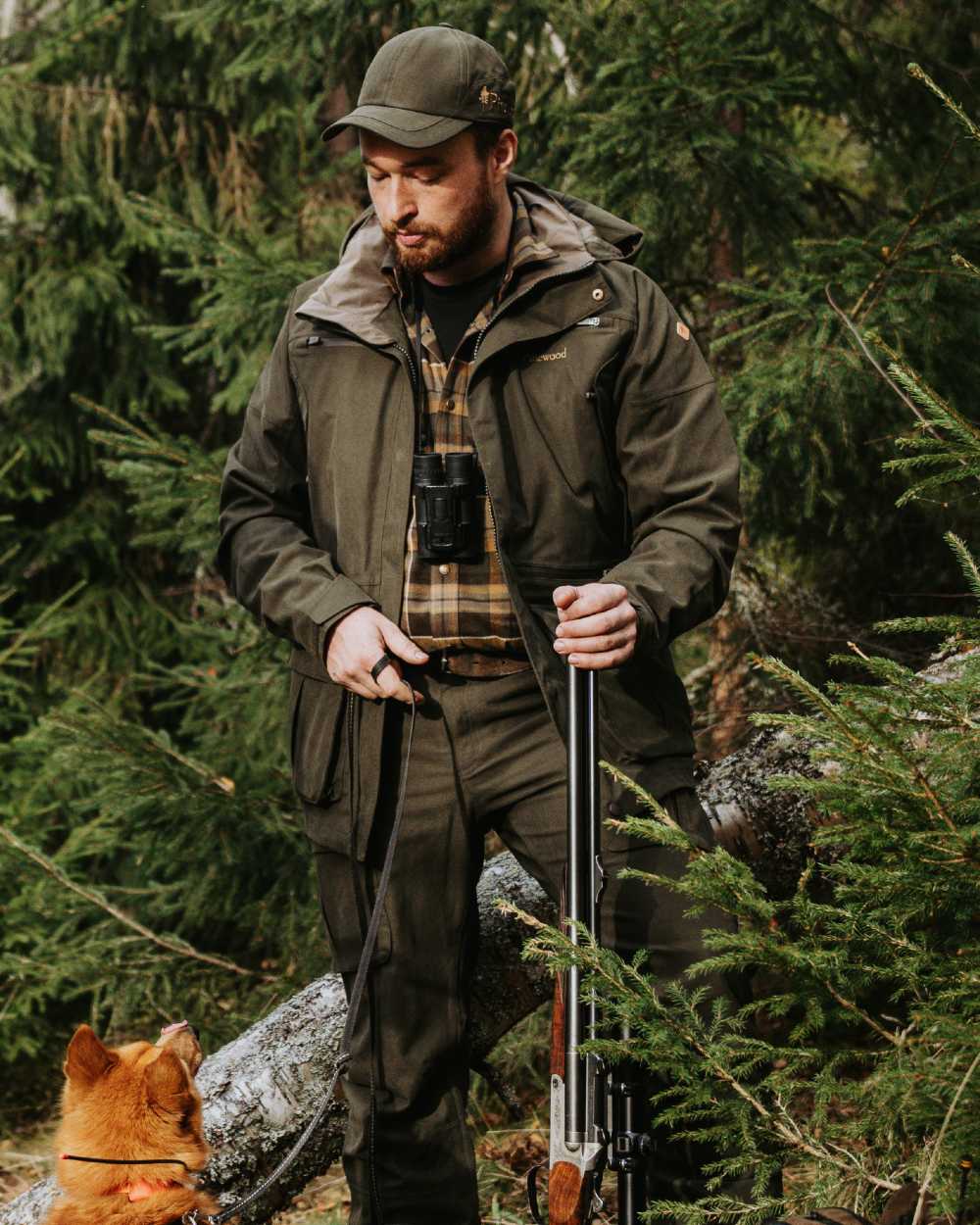 Dark Moss Green coloured Pinewood Mens Furudal Expert 2L Hunting Jacket on forest background 