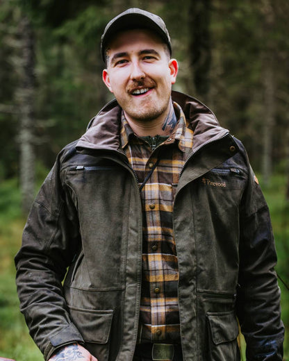 Dark Moss Green coloured Pinewood Mens Furudal Expert 2L Hunting Jacket on forest background 