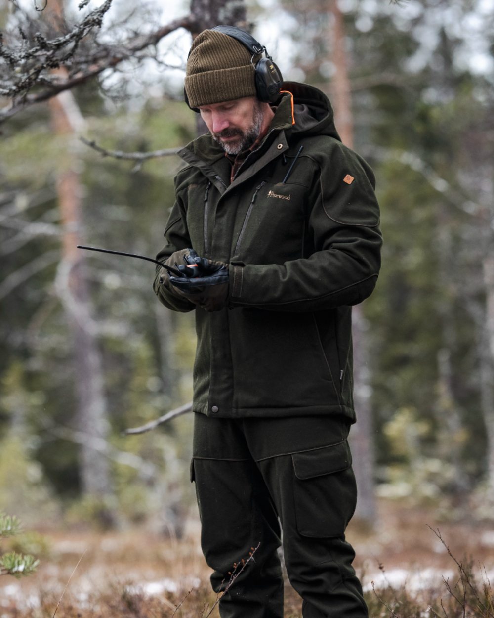 Moss Green coloured Pinewood Mens Furudal Hunters Wool Jacket on forest background 