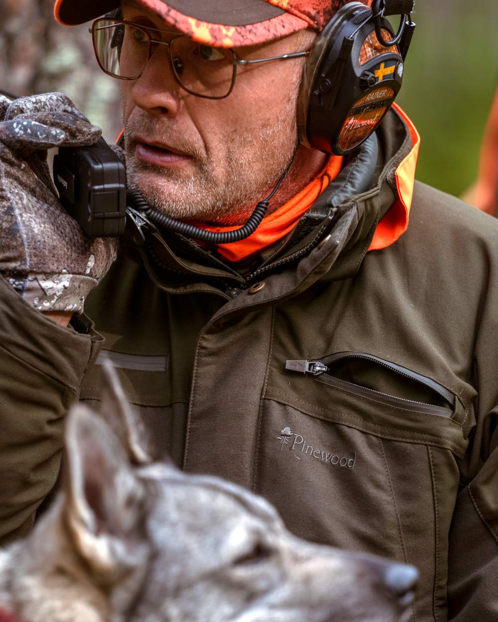 Moss Green coloured Pinewood Mens Hunter Pro Xtreme 2.0 Jacket on forest background 