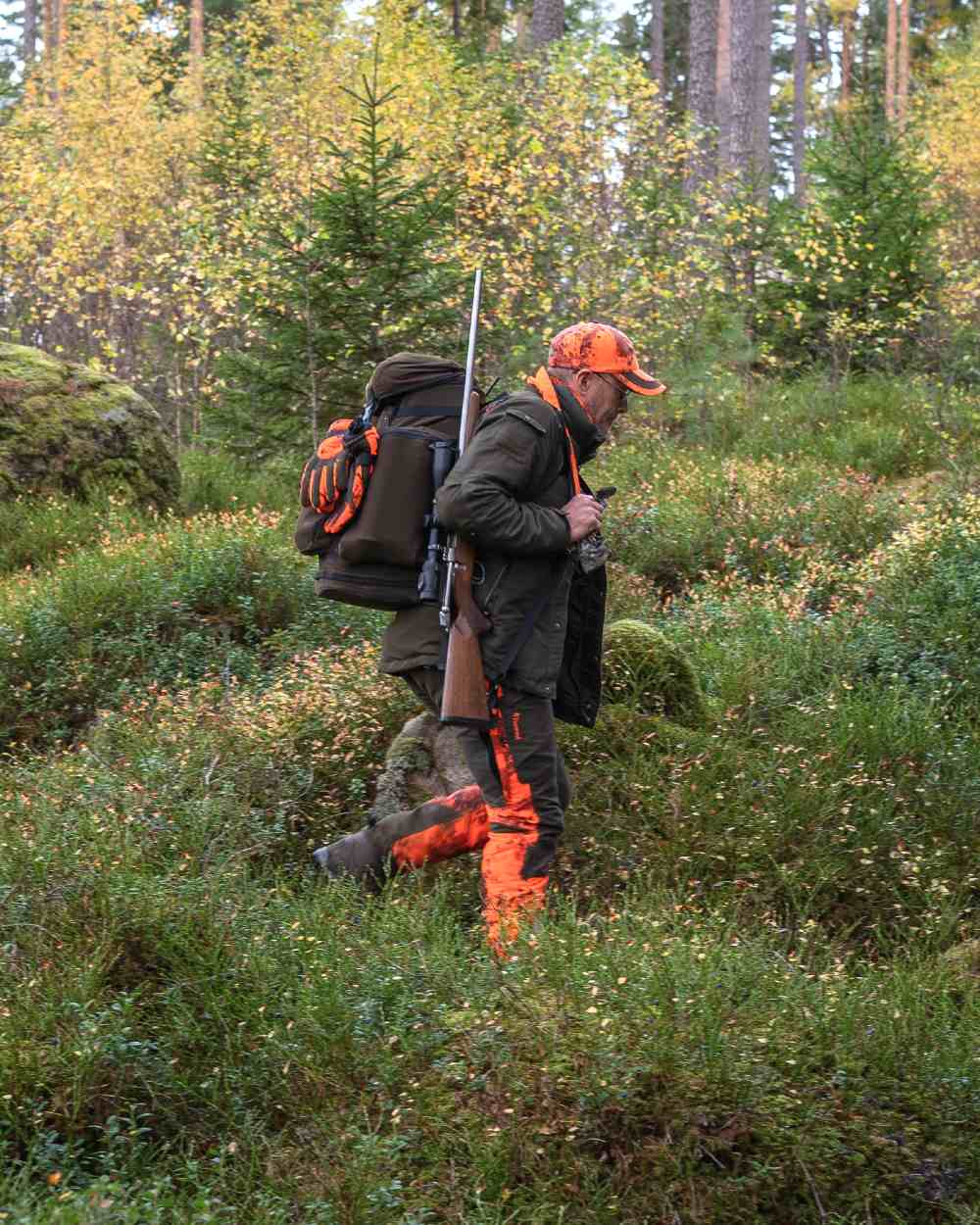 Moss Green coloured Pinewood Mens Hunter Pro Xtreme 2.0 Jacket on forest background 
