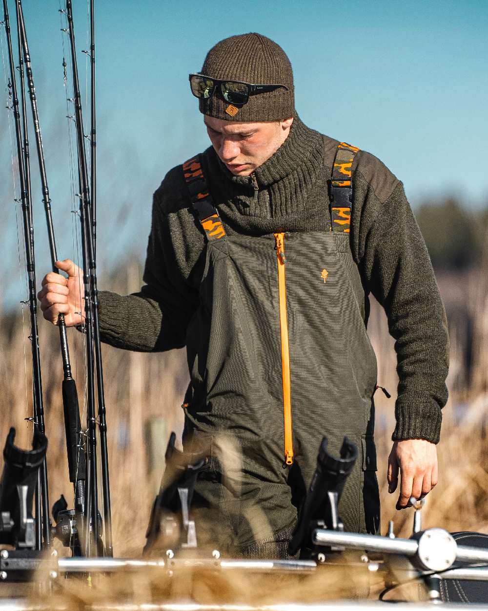 Dark Green Mel Coloured Pinewood Mens Hurricane Sweater on outdoor background 