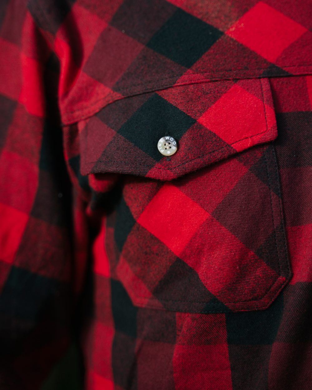 Red Black coloured Pinewood Mens Lumbo Shirt on forest background 