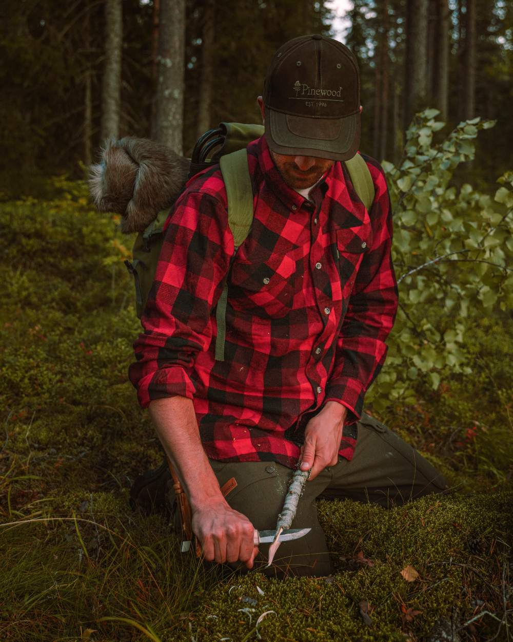Red Black coloured Pinewood Mens Lumbo Shirt on forest background 