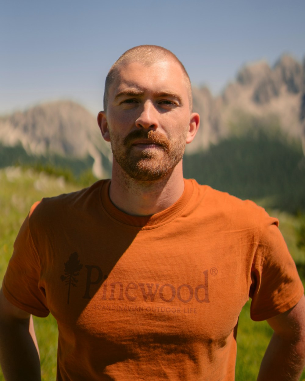 Burned Orange coloured Pinewood Mens Outdoor Life T-Shirt on mountain background 